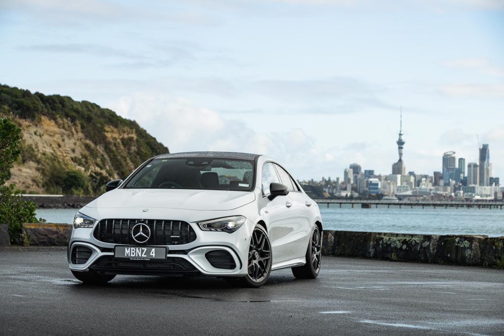 Mercedes-AMG CLA 45 S parked in front of Auckland's skyline