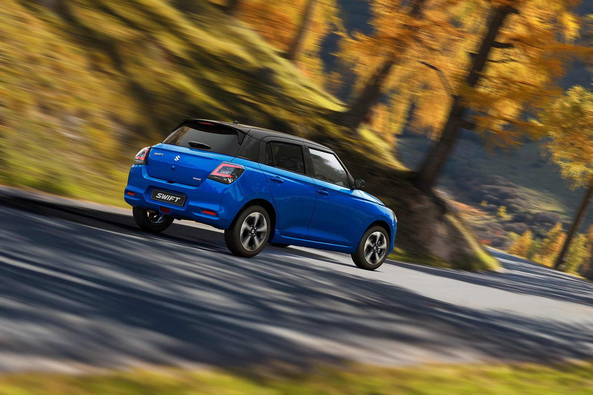 New Swift tearing up a winding road.