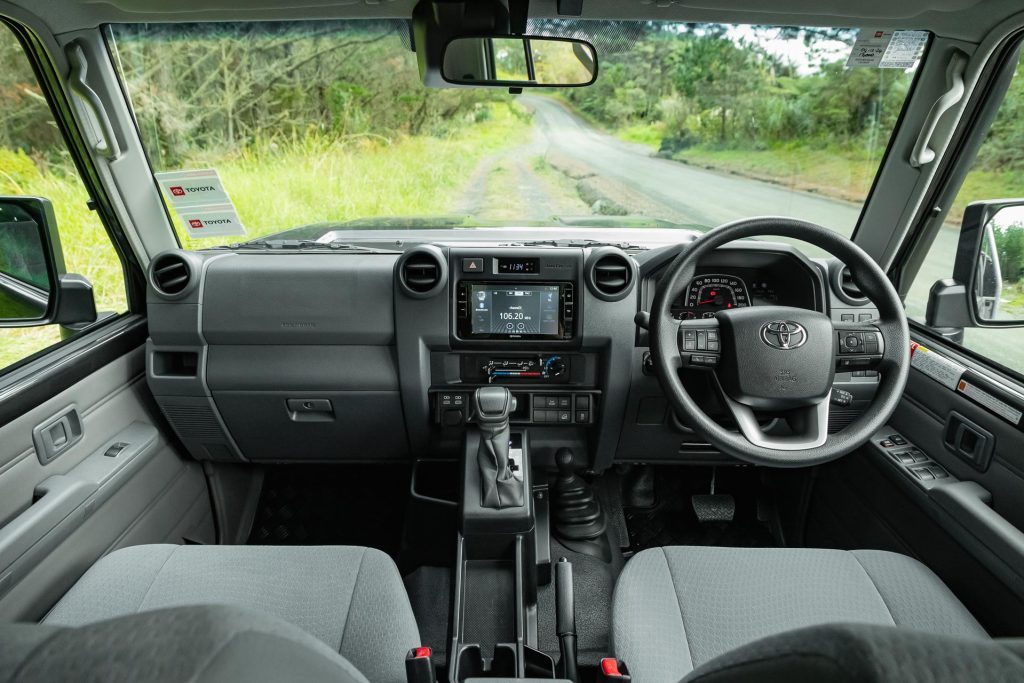 Toyota Land Cruiser 70 LT Double Cab interior wide view, showing dash and steering wheel