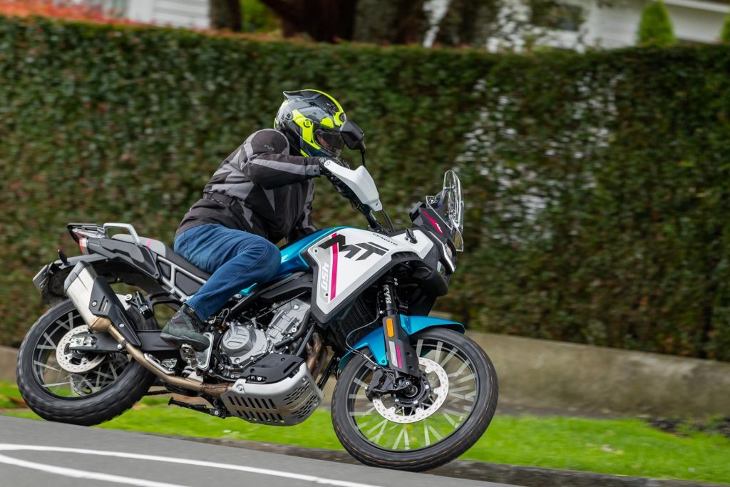 Side panning action shot of the CFMoto 450MT taking a corner