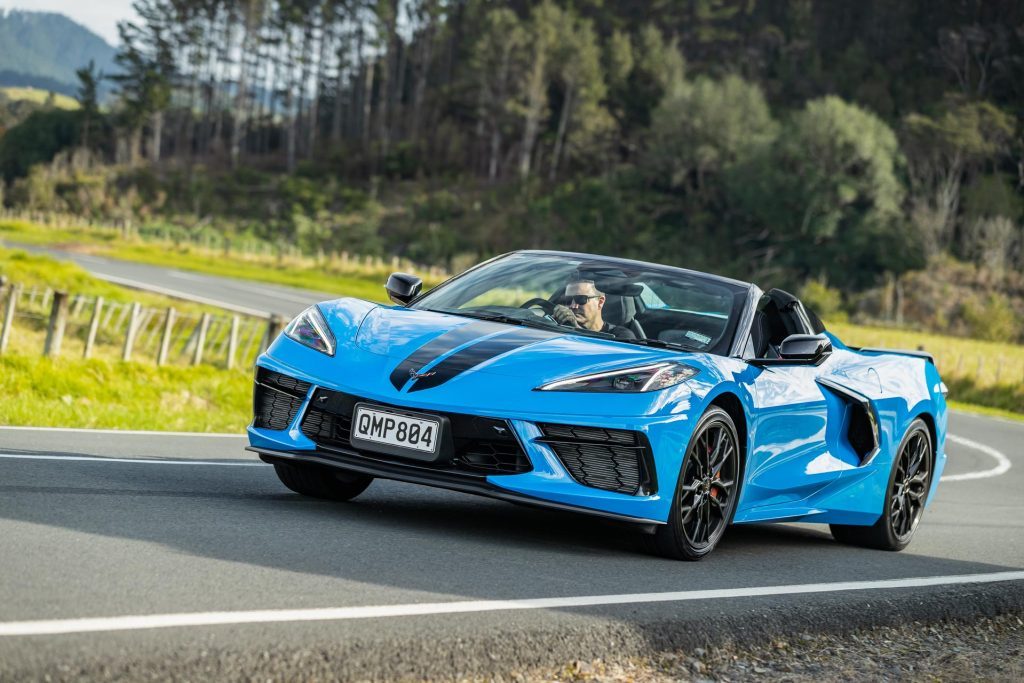 C8 Chevrolet Corvette Stingray 3LT Convertible, taking a corner at pace, in blue