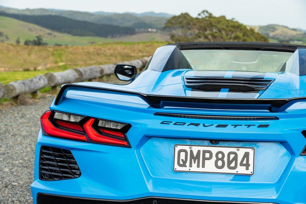 Blue Corvette Stingray convertible 2024, showing tail light detail