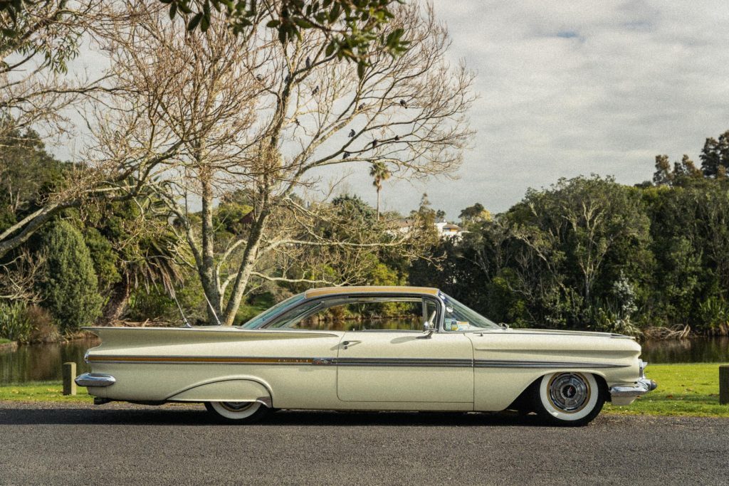 1959 Chevrolet Impala in cream, parked in Auckland, with a film look