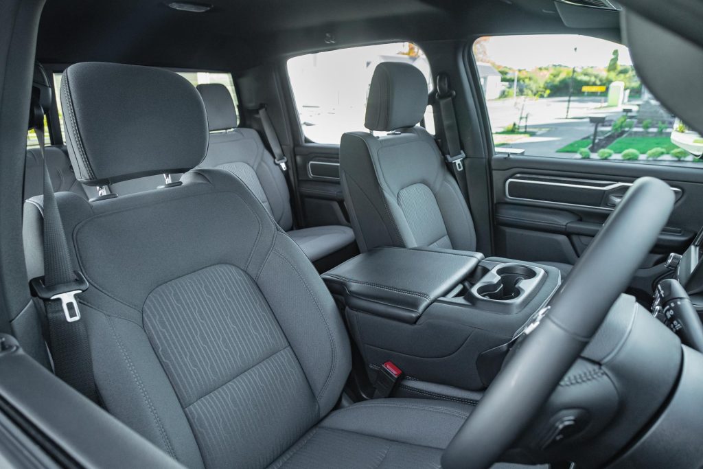 Front wide view inside the Ram 1500 Big Horn, showing front seats