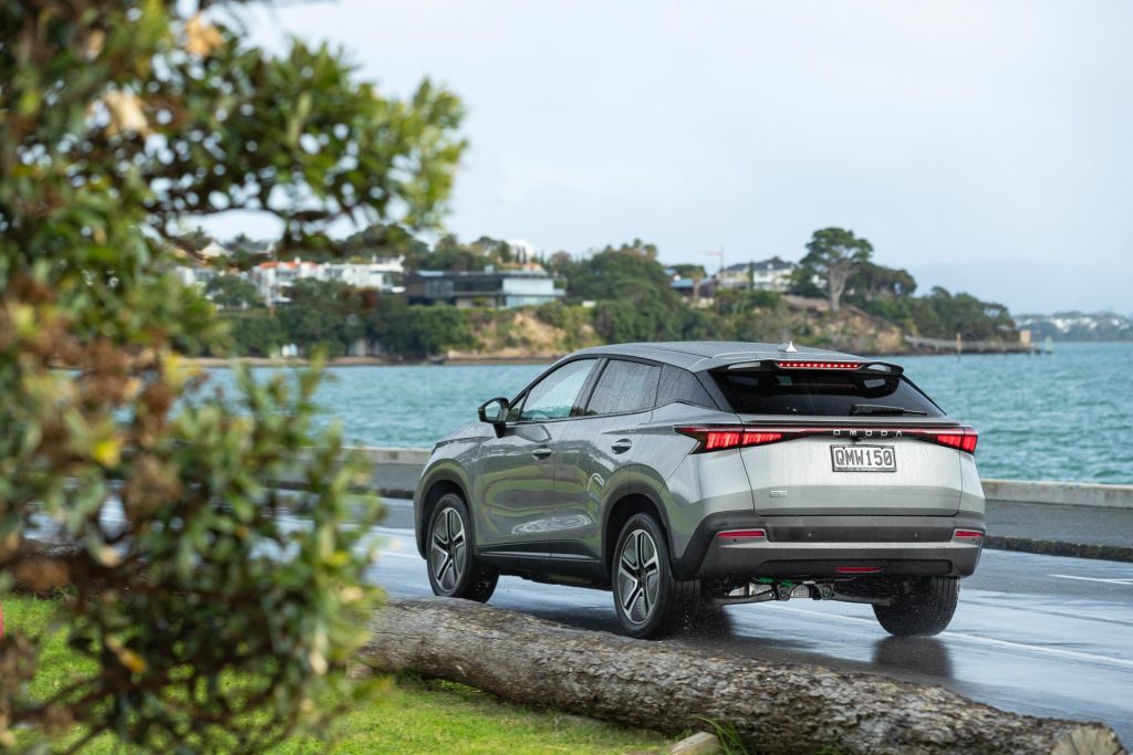 Omoda E5 EX driving past on the Auckland waterfront