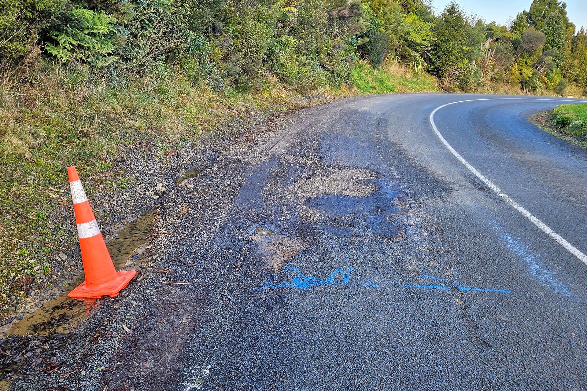 Road cone a temporary fix for a pothole in New Zealand.