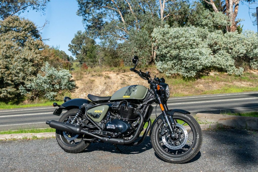 Royal Enfield Shotgun 650 in green and black, parked next to a road