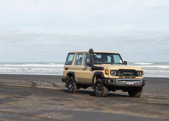 Toyota Land Cruiser 70 LX Wagon, parked on a New Zealand beach