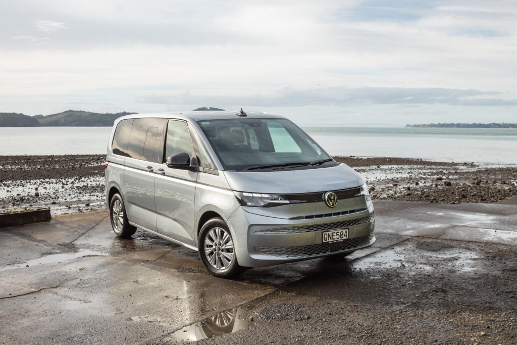 Volkswagen Multivan Family TDI, parked next to water