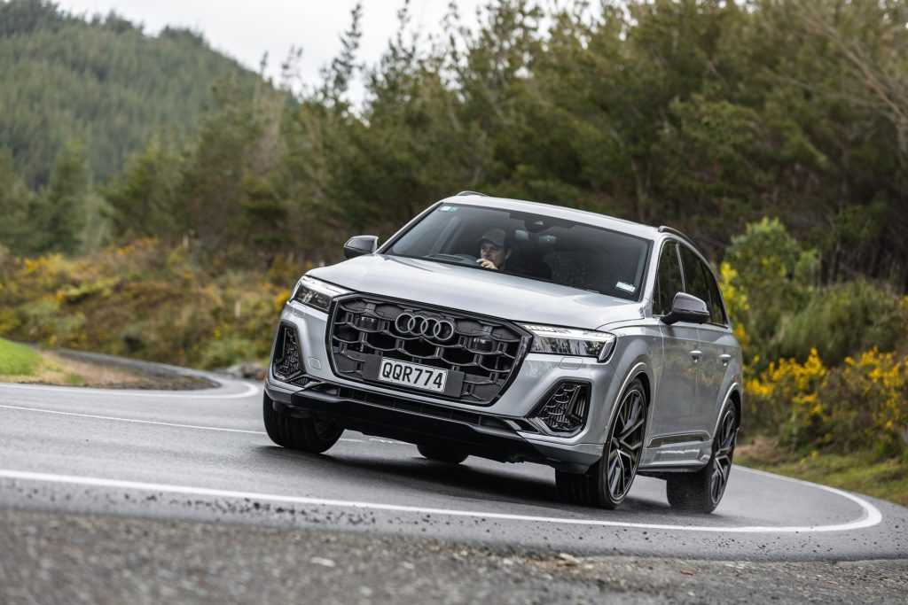 Cornering Audi SQ7 TFI, in silver, on an Auckland backroad