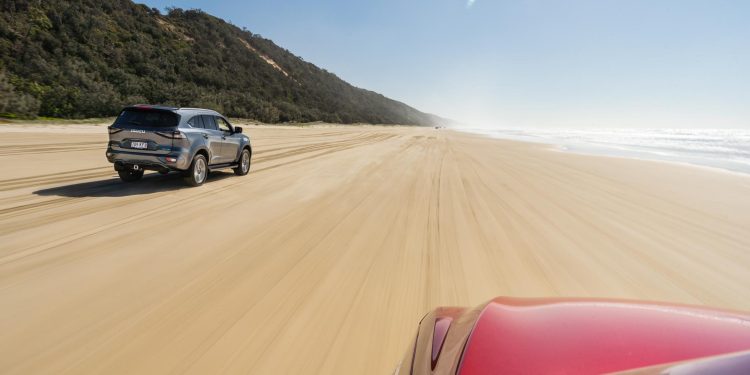 Noosa Beach drive rolling shot in Isuzu SUVs