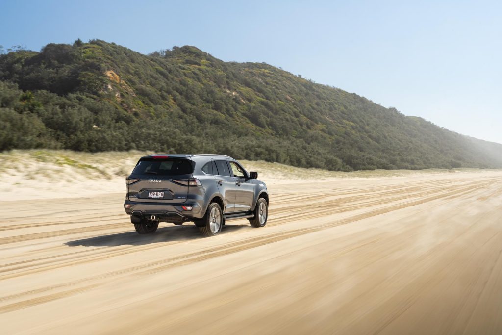 Isuzu MU-X driving on Australia's Noose national park, rolling shot