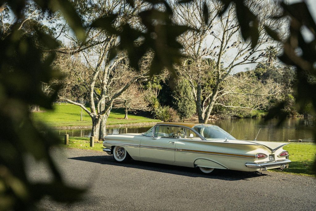 Chevrolet Impala Sport Coupe rear quarter, parked in front of a pond