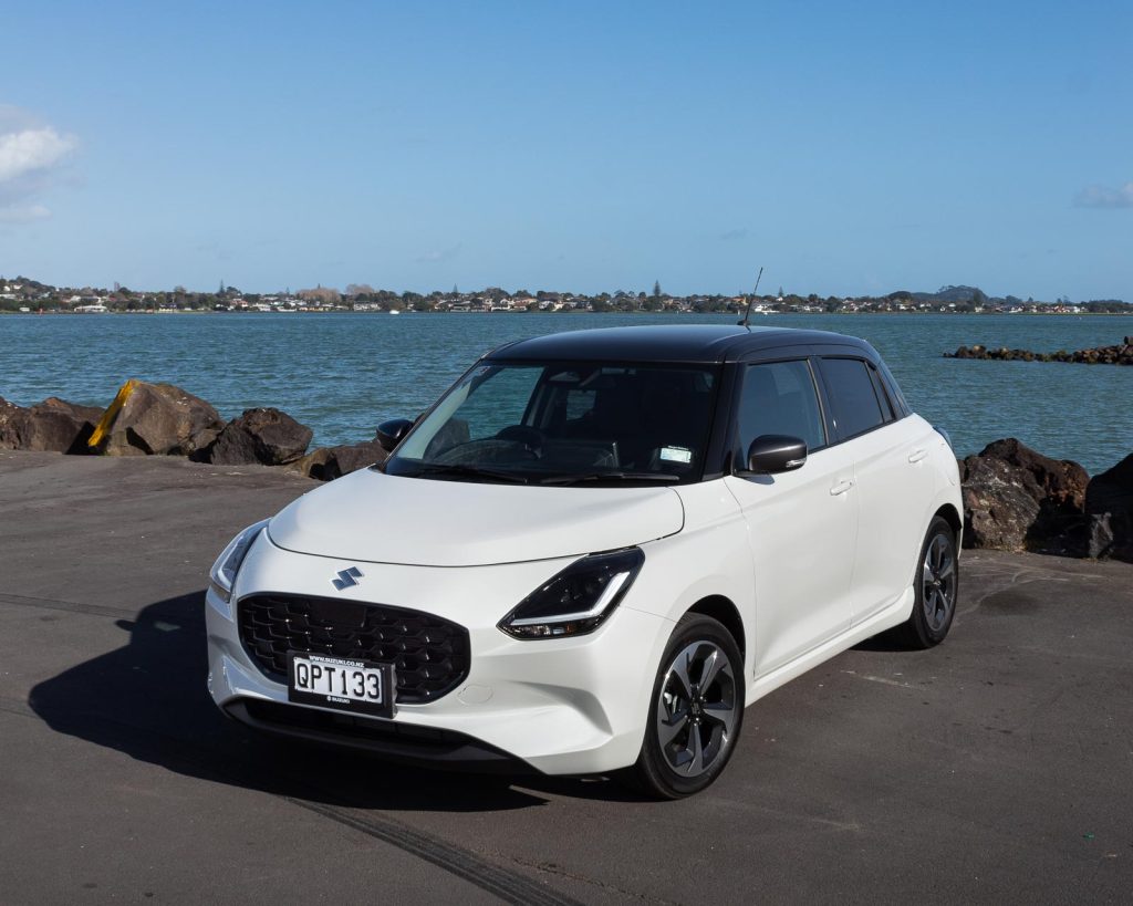 Suzuki Swift RSC in white, parked near the water