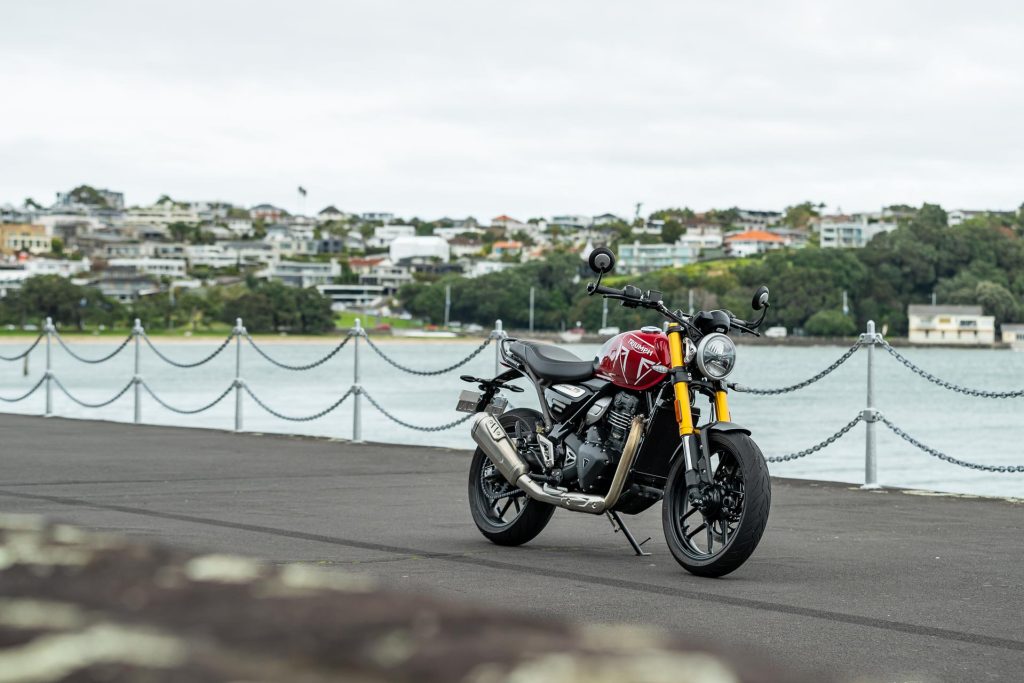 2024 Triumph Speed 400 front angle, with Auckland waterfront in behind