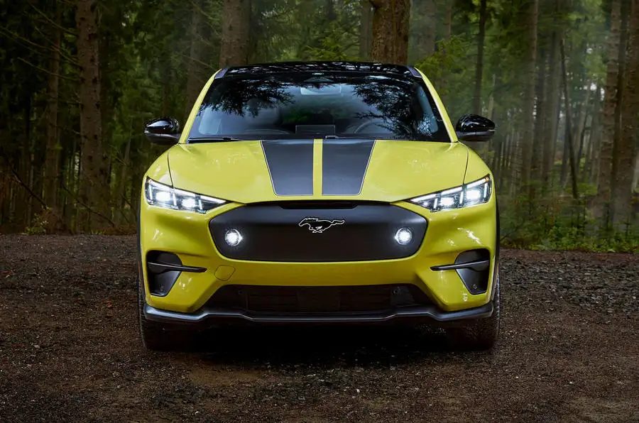 Aggressive front end with racing stripes and fog lights.