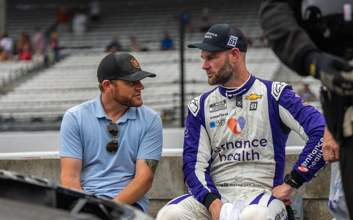 Shane van Gisbergen chats during downtime between races.