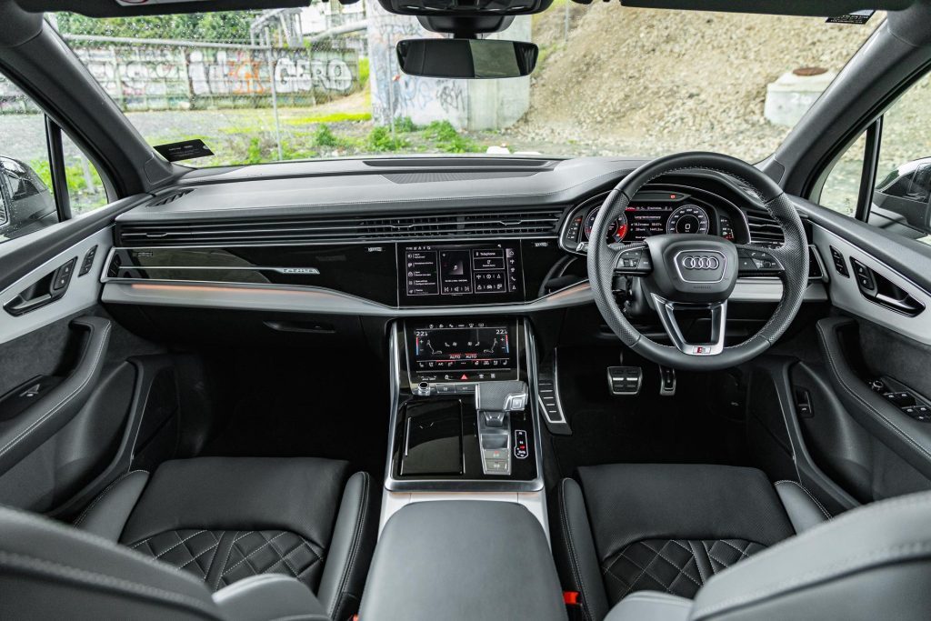 Wide interior view of the 2024 Audi SQ7 TFSI's dash and steering wheel