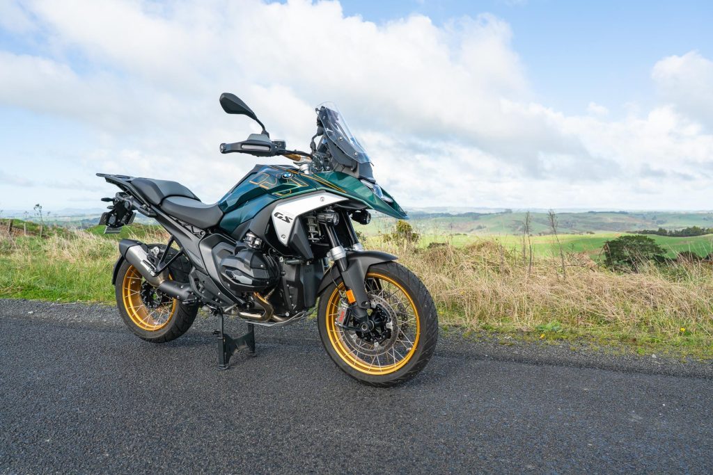 BMW-R-1300-GS in green and white, parked on a backroad