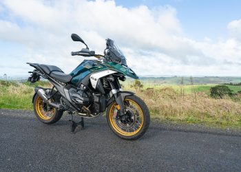 BMW-R-1300-GS in green and white, parked on a backroad