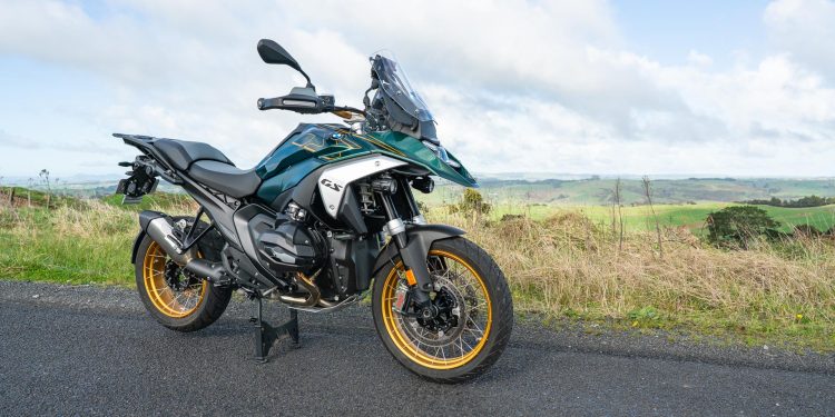 BMW-R-1300-GS in green and white, parked on a backroad