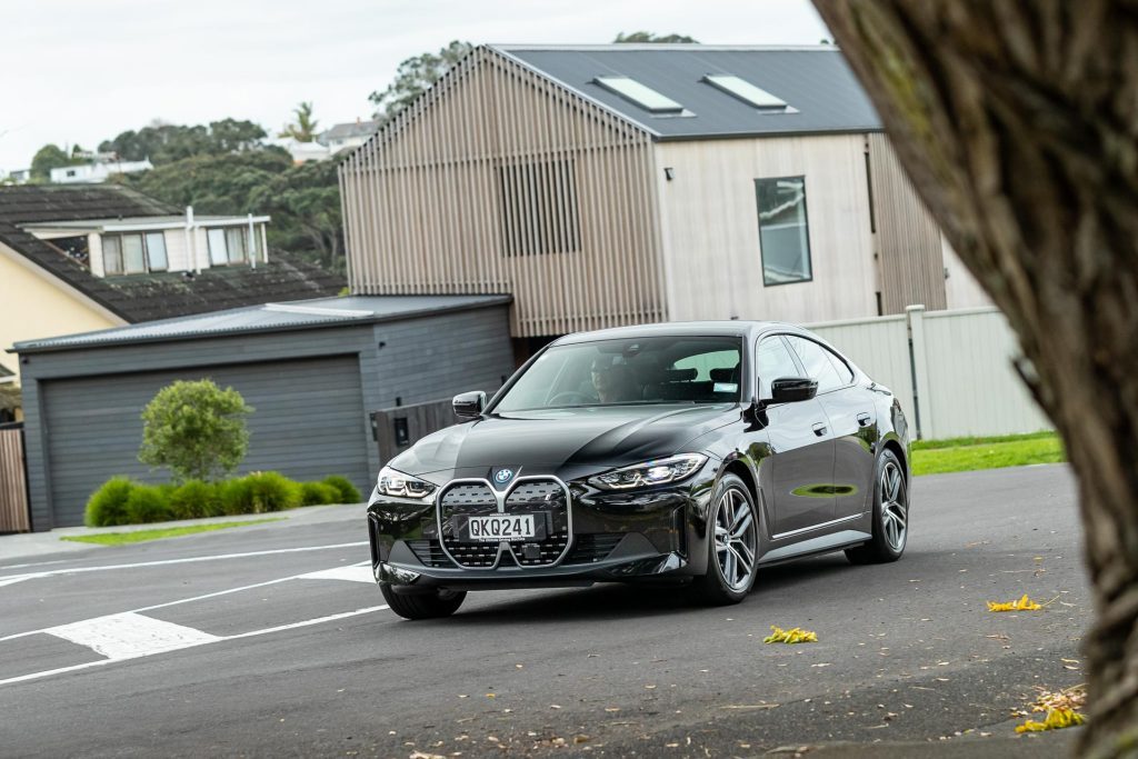 2024 BMW i4 eDrive35 taking a corner in an everyday environment