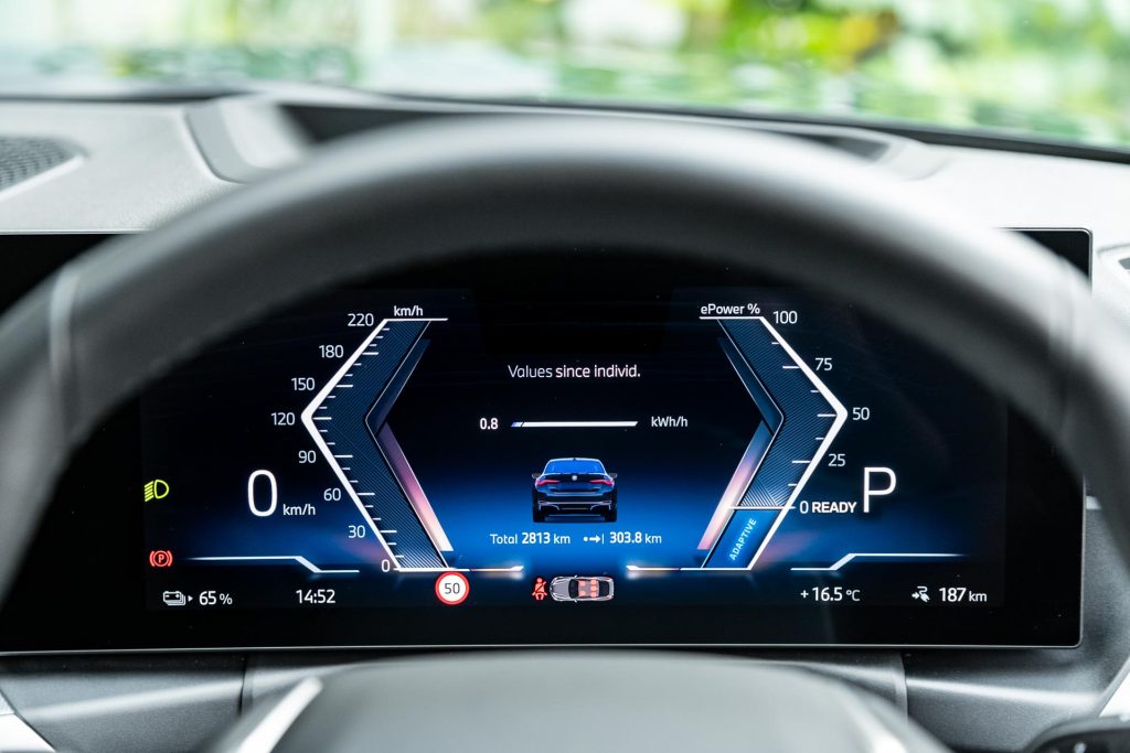 Driver view of the 2024 BMW i4 eDrive35's tachometer