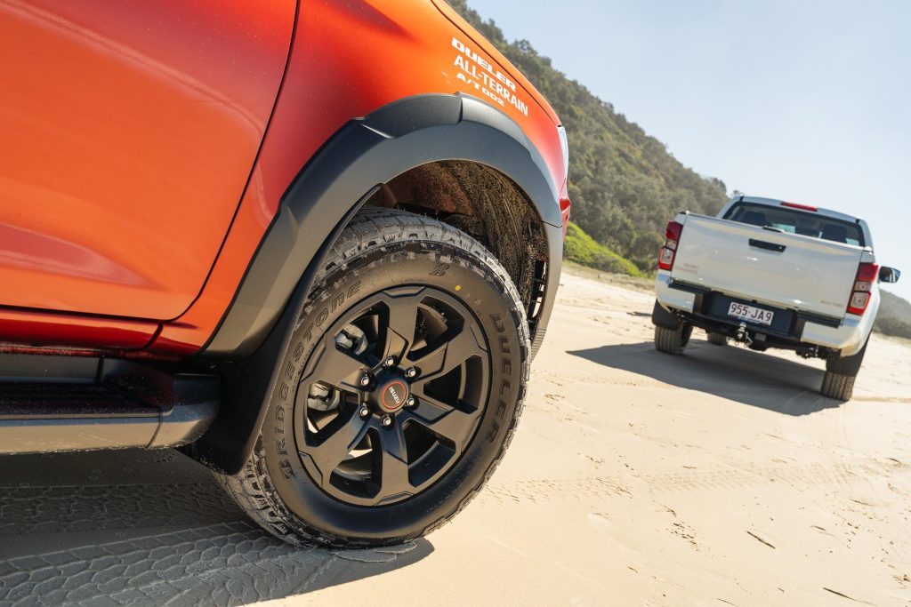 detail shot of Bridgestone Dueler A/T 002s on an orange isuzu