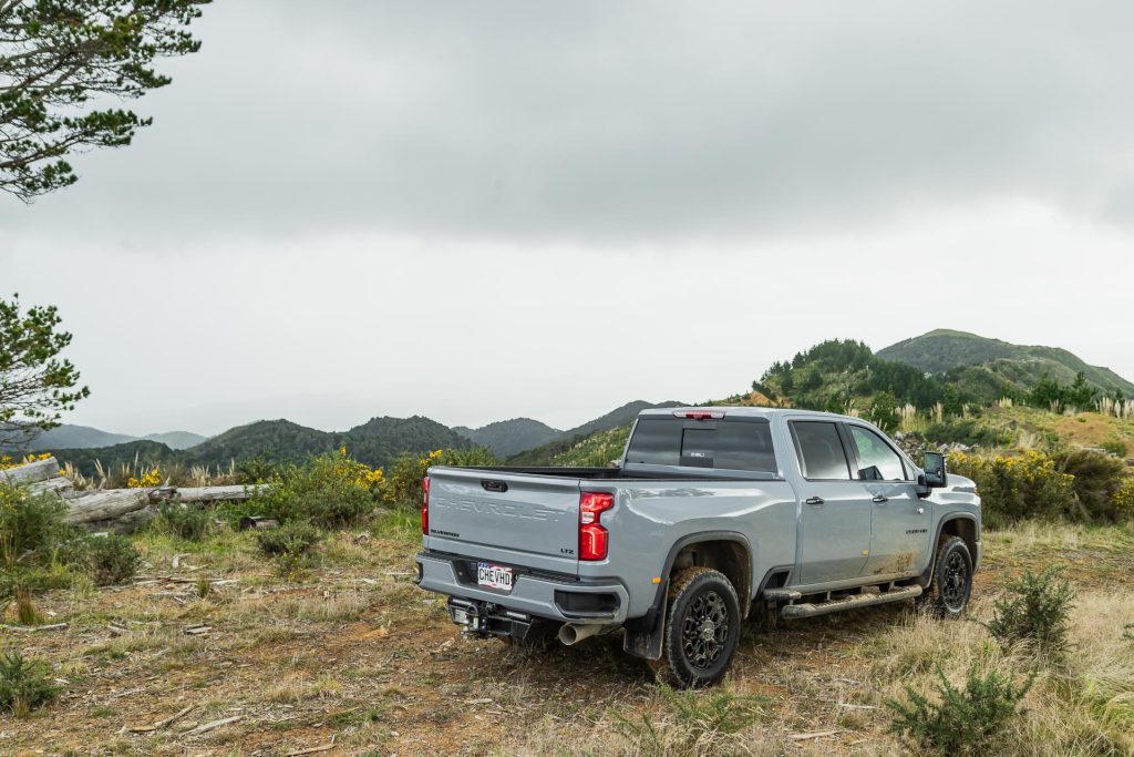 Rear quarter view of the 2024 Chevrolet Silverado 2500 HD LTZ Premium parked on a mountain range