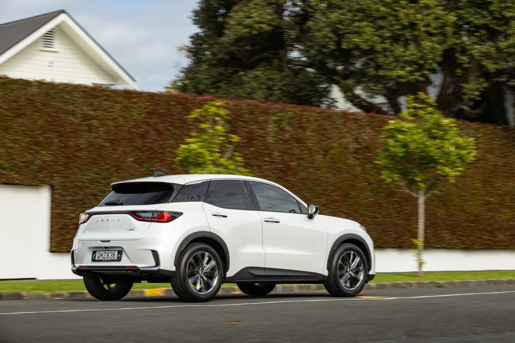 Rear quarter panning view of the 2024 Lexus LBX Relax in white