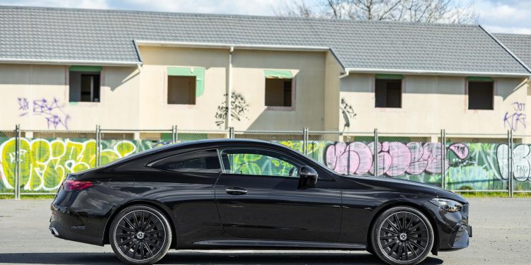 Mercedes-Benz CLE in black in front of graffiti