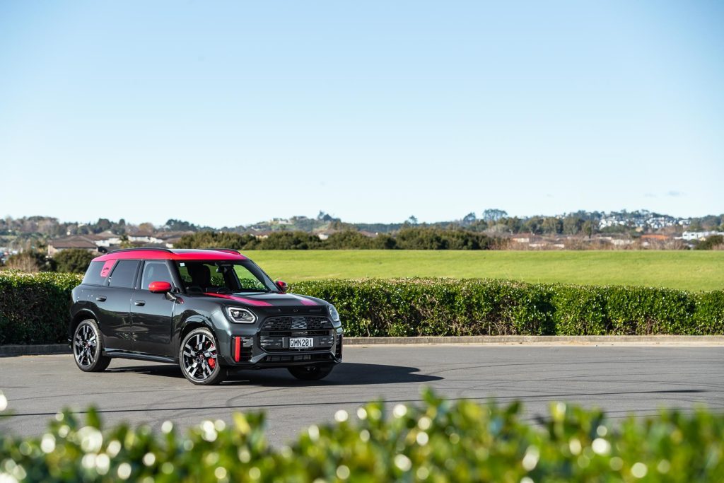 Mini Countryman JCW All4 Flavoured in black with red roof, parked at a park