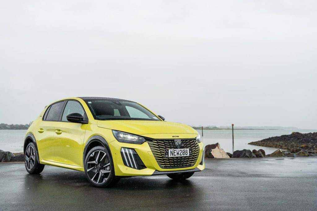 Front quarter view of the 2024 Peugeot 208 GT Hybrid pictured in yellow