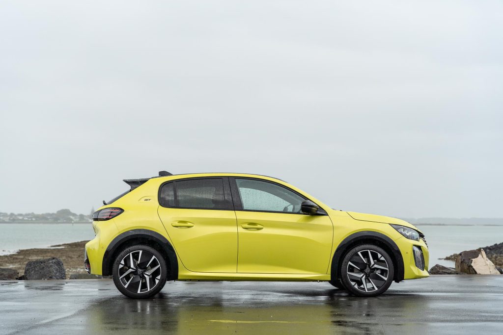 2024 Peugeot 208 GT Hybrid side profile shot, in Yellow.