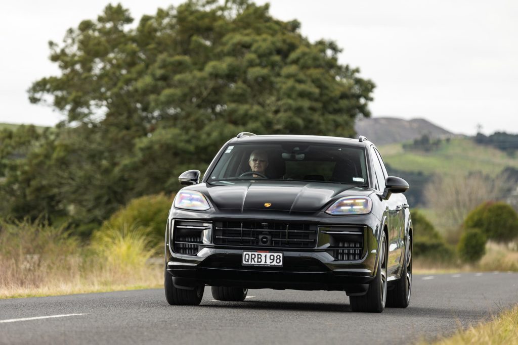 2024 Porsche Cayenne GTS approaching on a long road