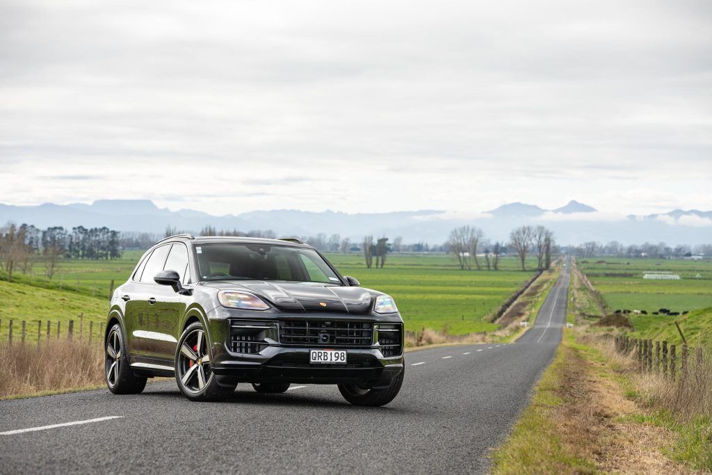 2024 Porsche Cayenne GTS long shot with trailing straight road behind it