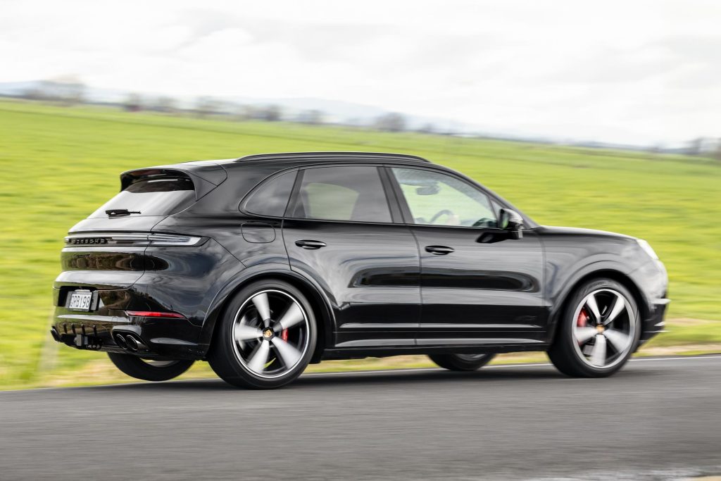 2024 Porsche Cayenne GTS lifting a wheel as it turns the corner