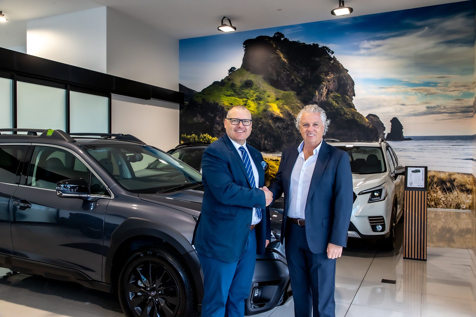 Inchcape's Kym Mellow congratulates Winger Owner Wayne Leach on the opening of the new West Auckand Subaru dealership.