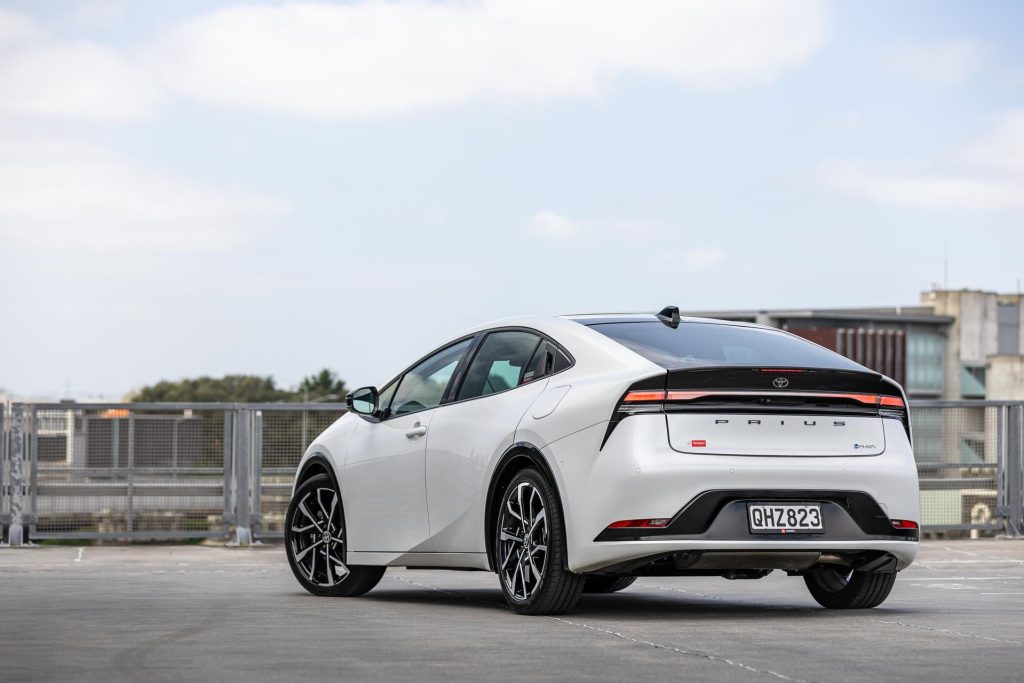 Toyota Prius PHEV in white - parked on a rooftop