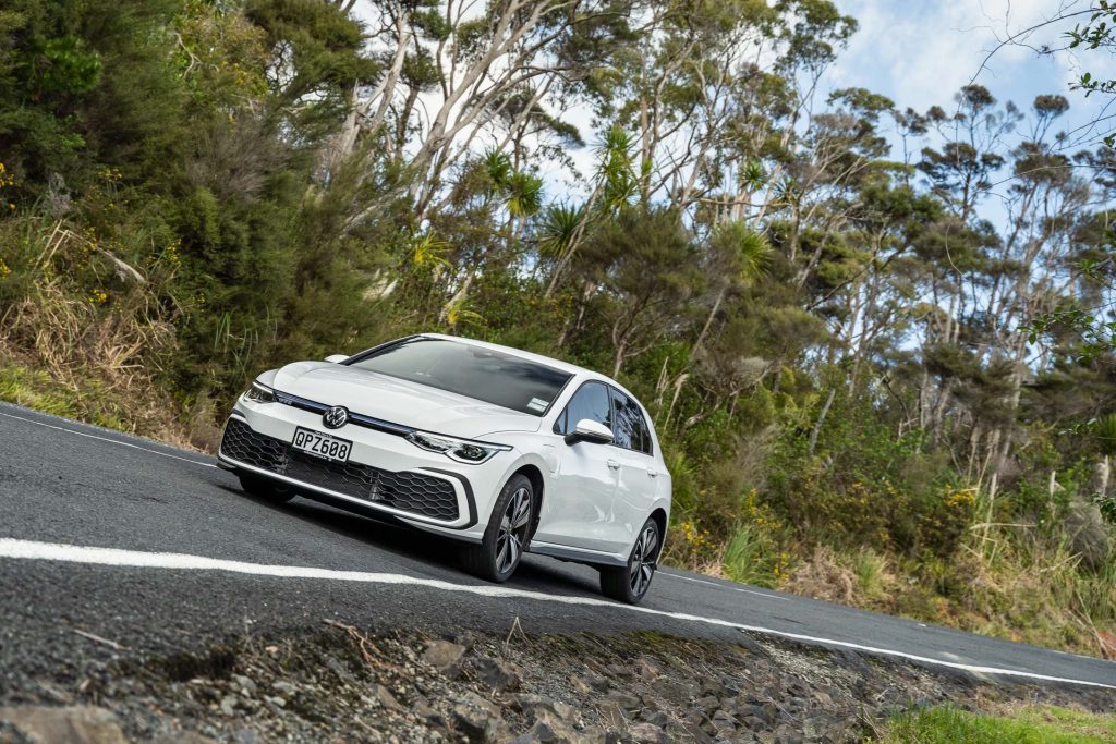 2024 Volkswagen Golf GTE passing through a corner, taken from the inside