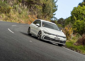 VW Golf GTE in white, cornering shot at pace.