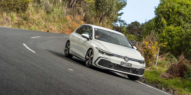 VW Golf GTE in white, cornering shot at pace.