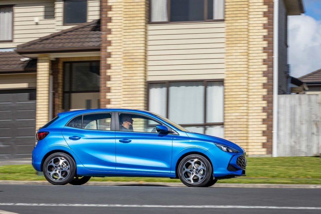 2024 MG3 Hybrid Essence panning side shot, in a residential area