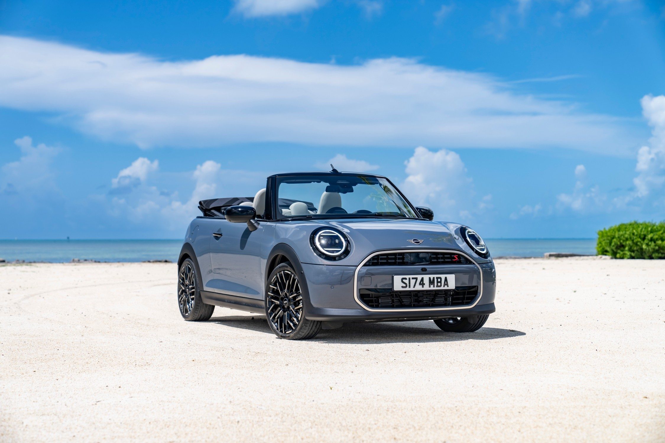 Mini Convert on the beach, a small car living life large.