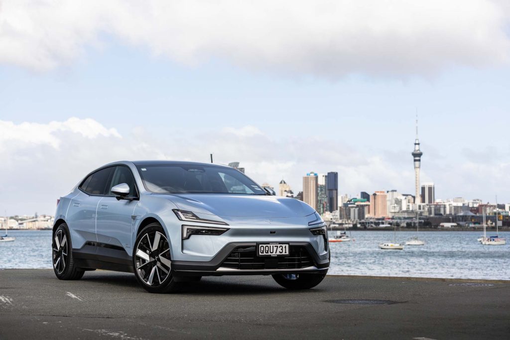 front quarter shot of the Polestar 4 in front of the Skytower and Auckland City