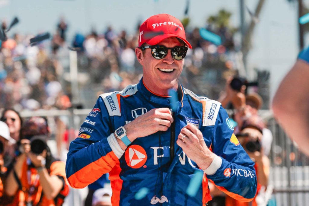 Scott Dixon with sunglasses smiling with confetti