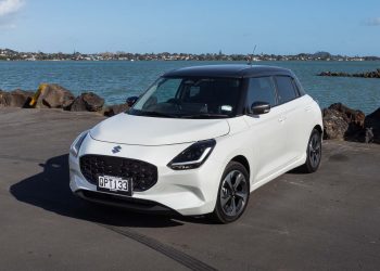 White Suzuki Swift RSC in white, parked next to the sea