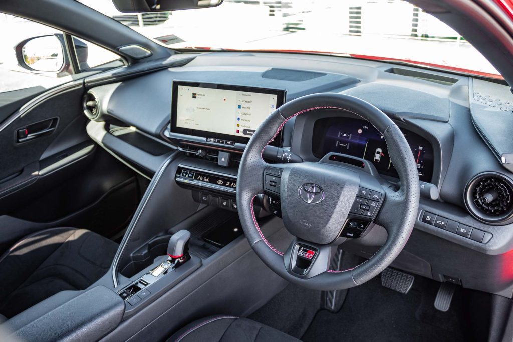 Interior of the Toyota C-HR GR, showing steering wheel and driver layout