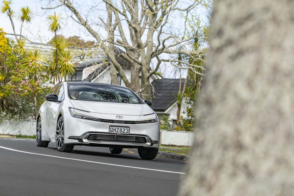 Cornering shot, showing front quarter of white car