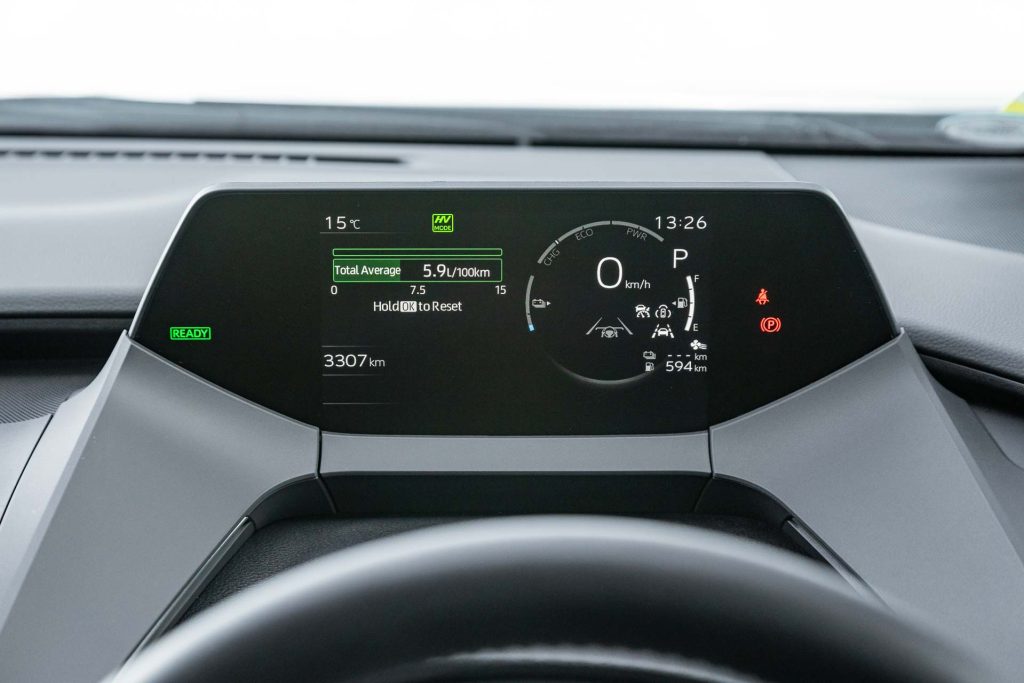 Tachometer display showing fuel efficiency